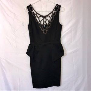Black bodycon dress with embellished neckline